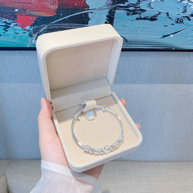 Nuvella - Elegant Silver Lucky Bead Bracelet