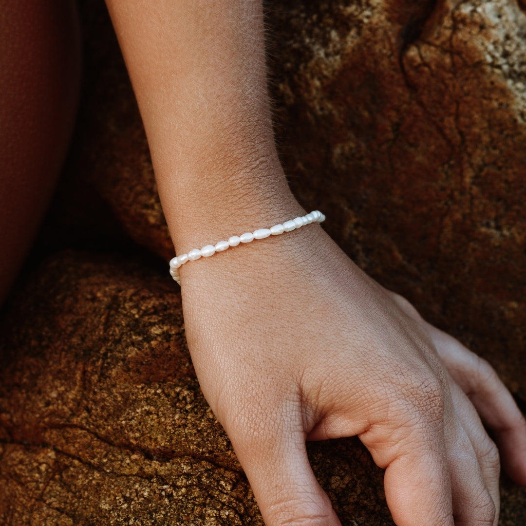 Evarina - Freshwater Pearl Bracelet with Elegant Charm