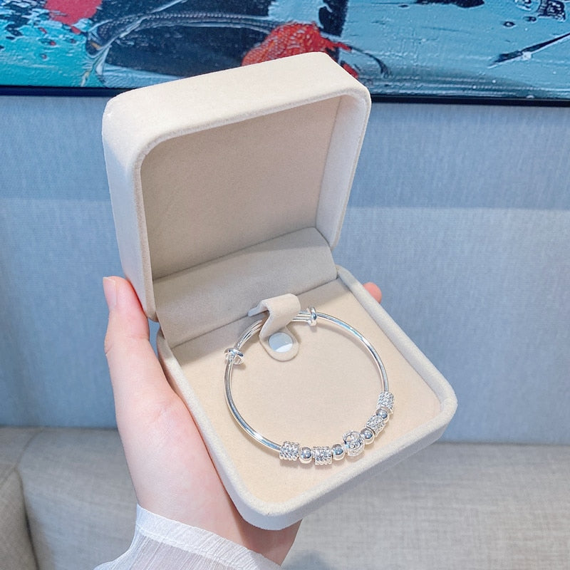 Nuvella - Elegant Silver Lucky Bead Bracelet