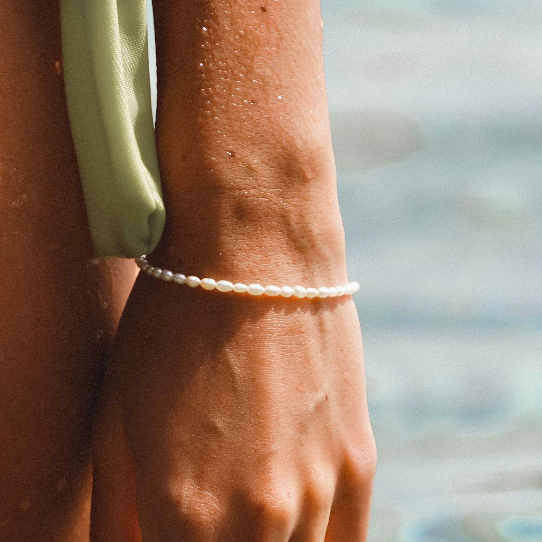 Evarina - Freshwater Pearl Bracelet with Elegant Charm